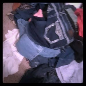 A whole bunch of women size 16 pants and skirts